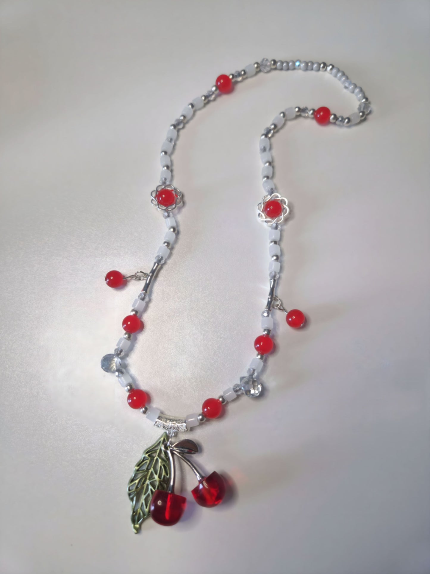 Beaded necklace in red, white and silver
