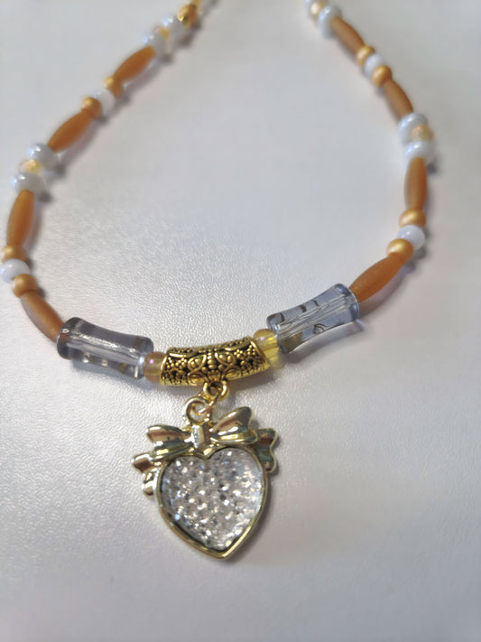 Beaded necklace in gold, brown and white